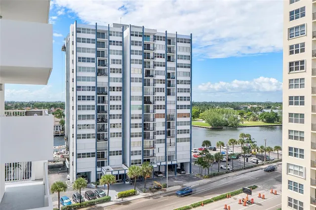 a front view of a building with a yard