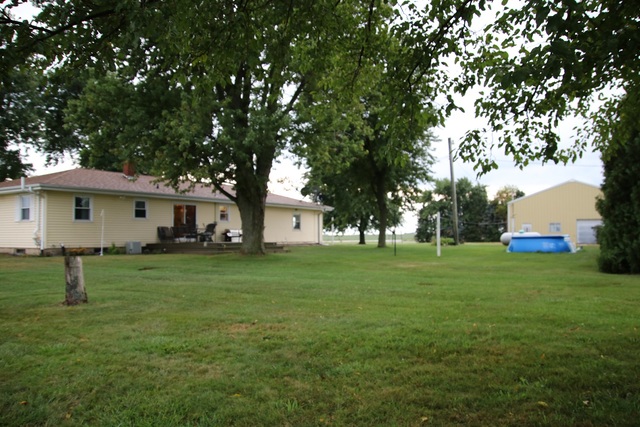 14483 Perry Road DeKalb, IL 60115 - Photo 12 of 14 a front view of a house with a yard