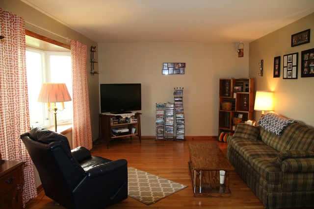 14483 Perry Road DeKalb, IL 60115 - Photo 3 of 14 a living room with furniture and a flat screen tv