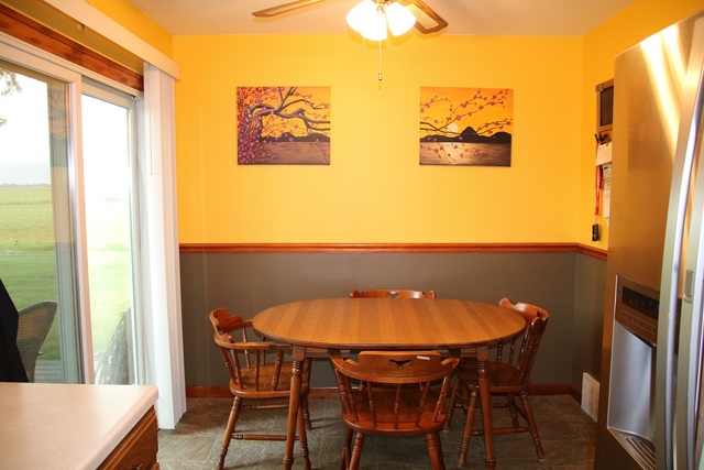 14483 Perry Road DeKalb, IL 60115 - Photo 6 of 14 a view of a dining room with furniture and a window