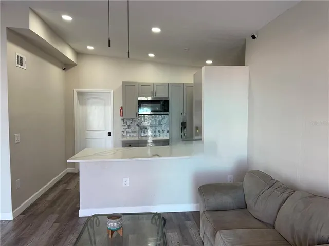 a view of living room filled with furniture and window