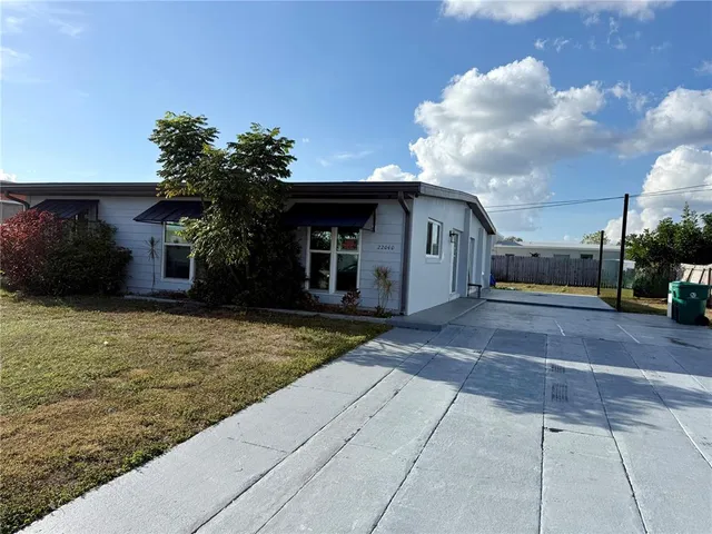 a view of a house with a yard