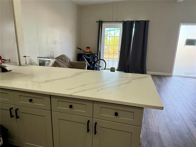 a room with sink and mirror