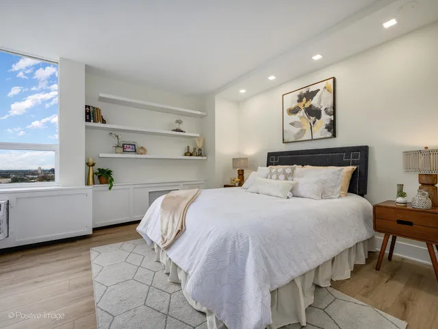 a bedroom with a bed and window