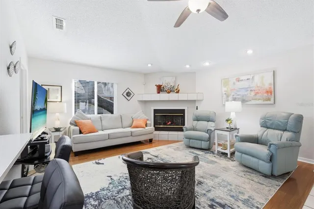 a living room with furniture and a fireplace