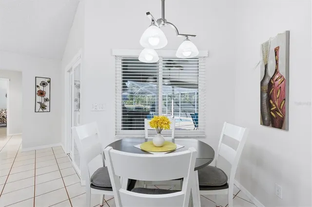 a kitchen with stainless steel appliances a stove a sink cabinets and a refrigerator