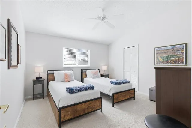 a bedroom with a bed and a lamp