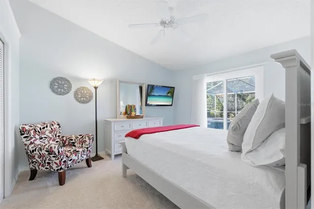 a bedroom with a bed and a painting on the wall