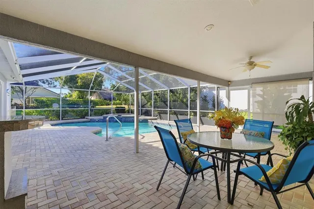a view of a backyard with swimming pool