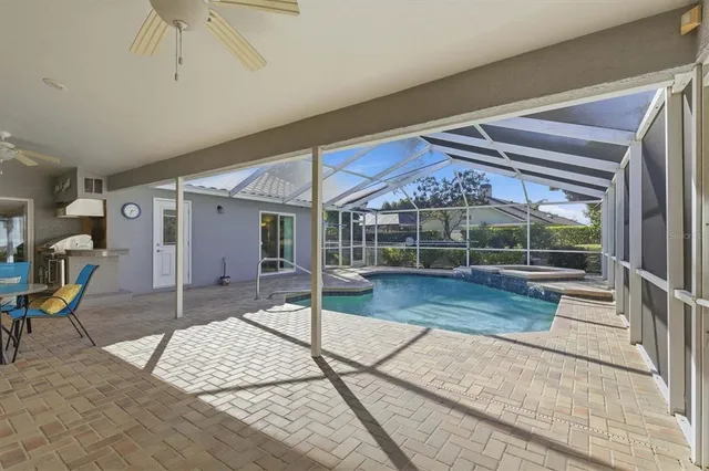 a view of a backyard with table and chairs with wooden floor and fence