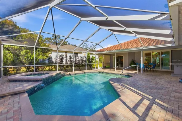 a view of a house with a yard and furniture