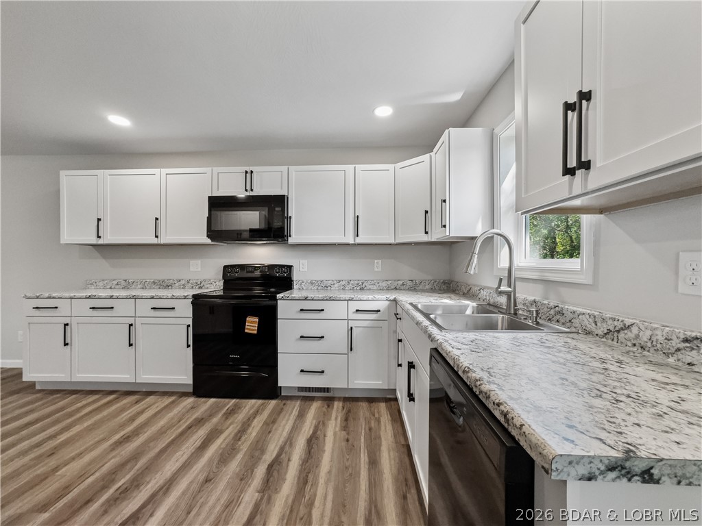 324 3rd Street Camdenton, MO 65020 - Photo 11 of 52 All new cabinets, flooring ,windows and appliances