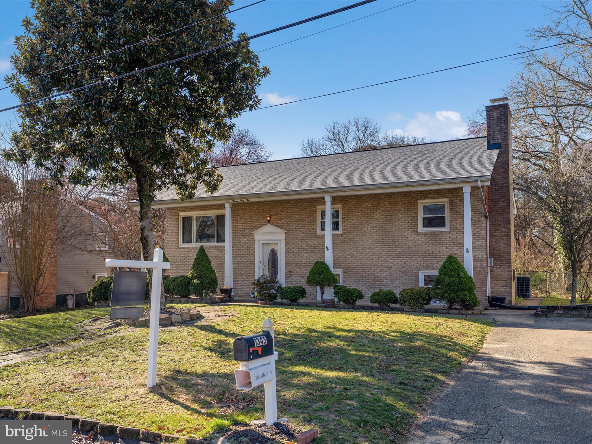 1345 Ava Road Severn, MD 21144 - Photo 1 of 41 a front view of a house with garden