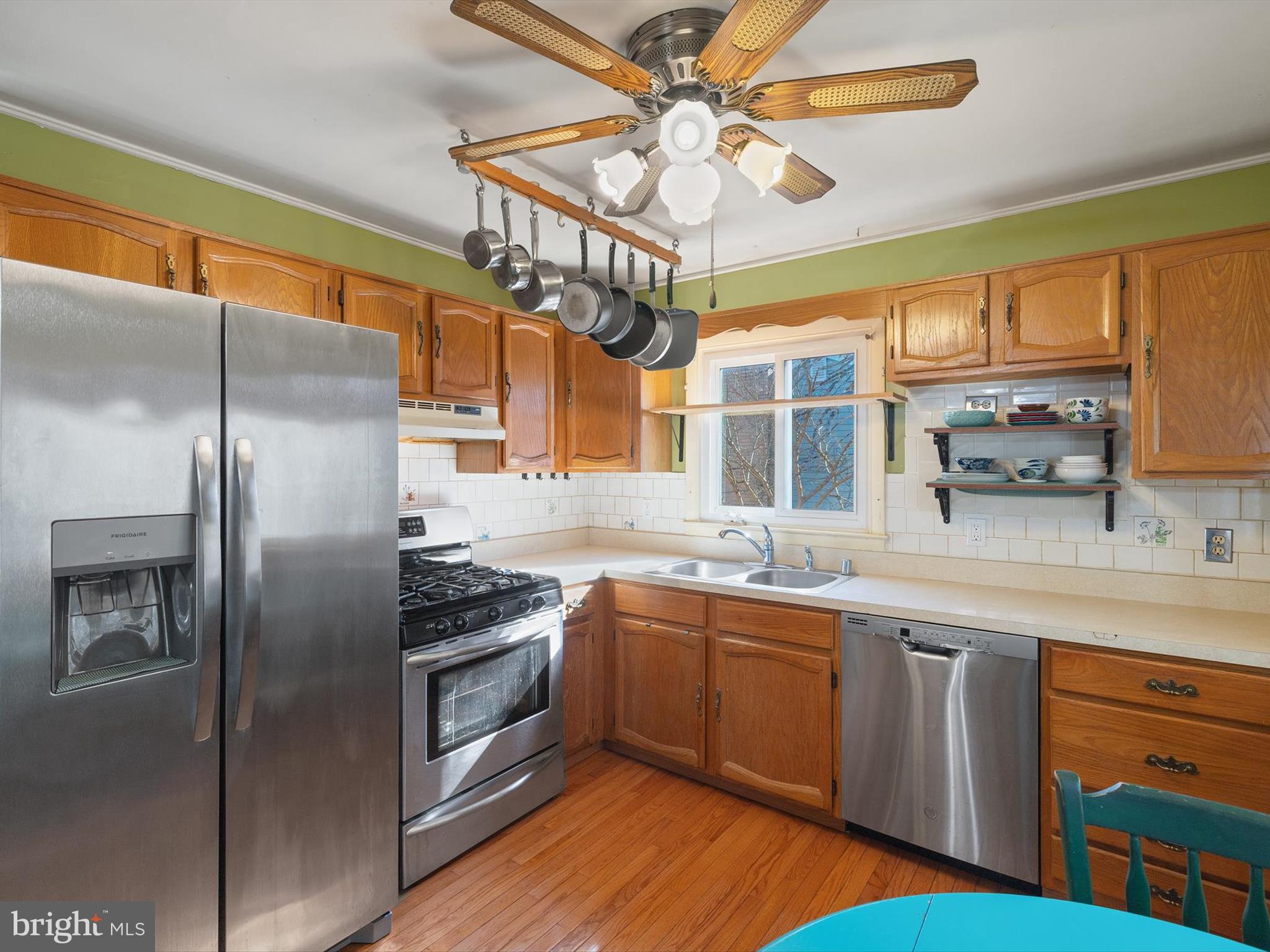 1345 Ava Road Severn, MD 21144 - Photo 13 of 41 a kitchen with a sink stainless steel appliances cabinets and a large window