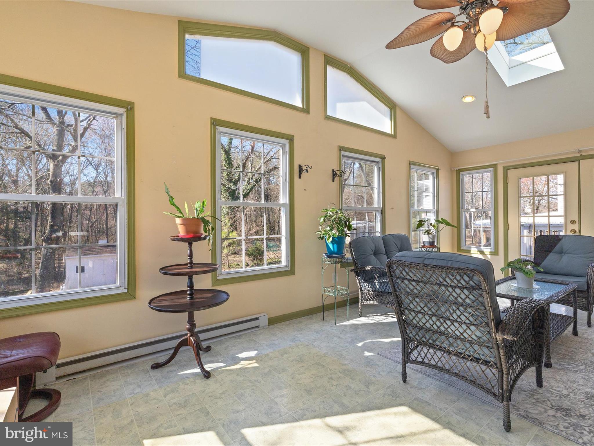 1345 Ava Road Severn, MD 21144 - Photo 18 of 41 a living room with furniture a chandelier and a window
