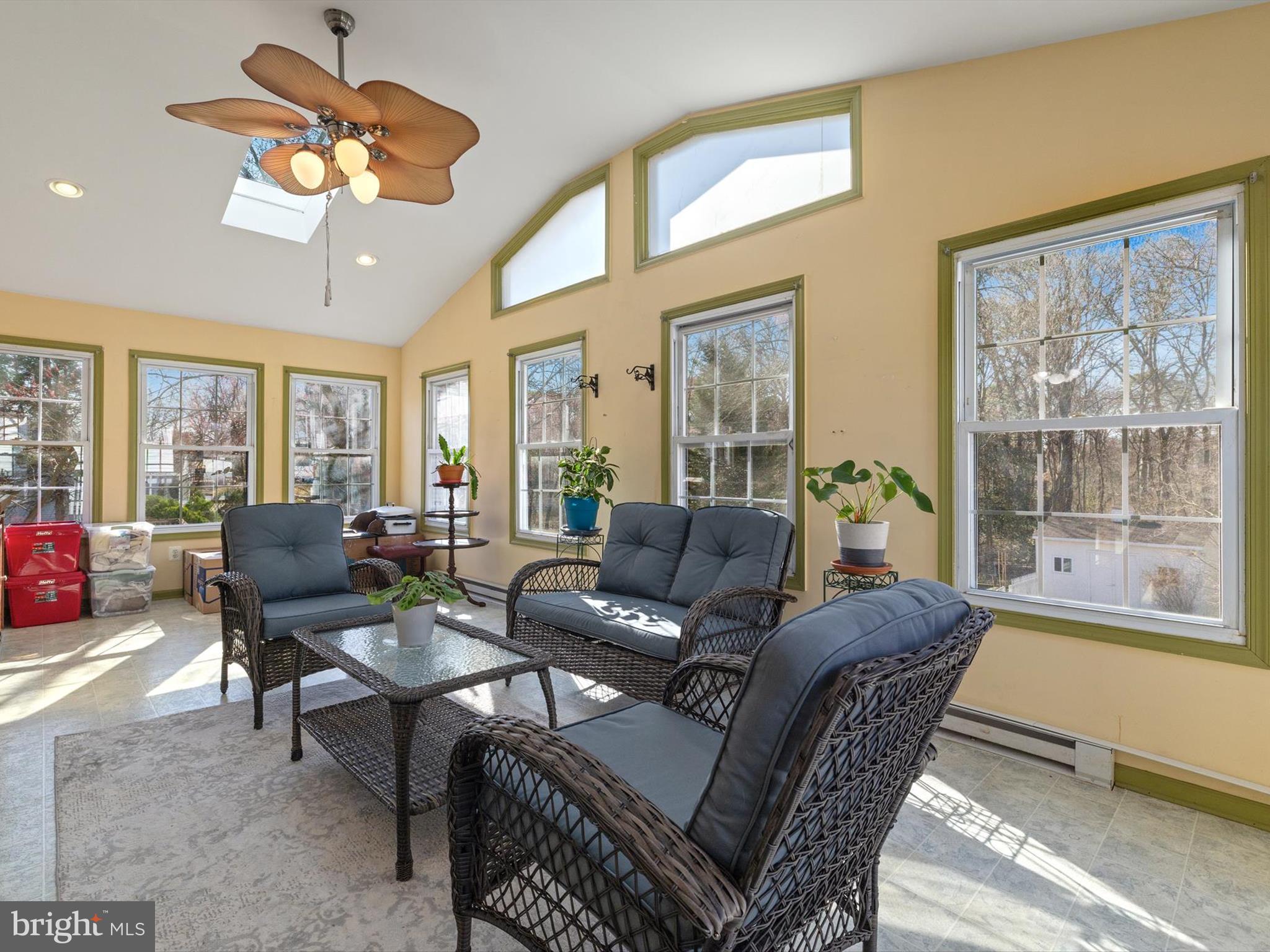 1345 Ava Road Severn, MD 21144 - Photo 19 of 41 a living room with furniture a chandelier and a large window