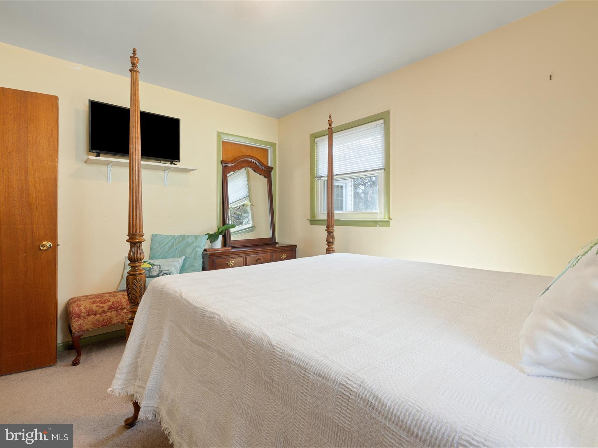 1345 Ava Road Severn, MD 21144 - Photo 25 of 41 a bedroom with a bed a window and a flat screen tv