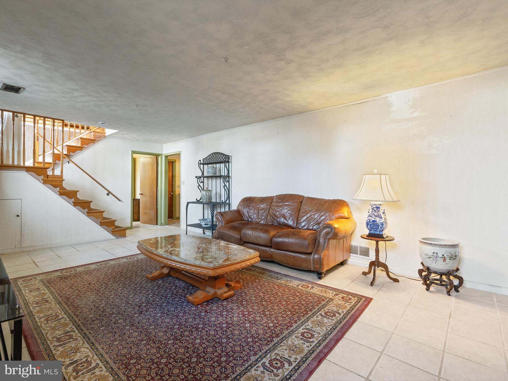 1345 Ava Road Severn, MD 21144 - Photo 30 of 41 a living room with furniture and a rug