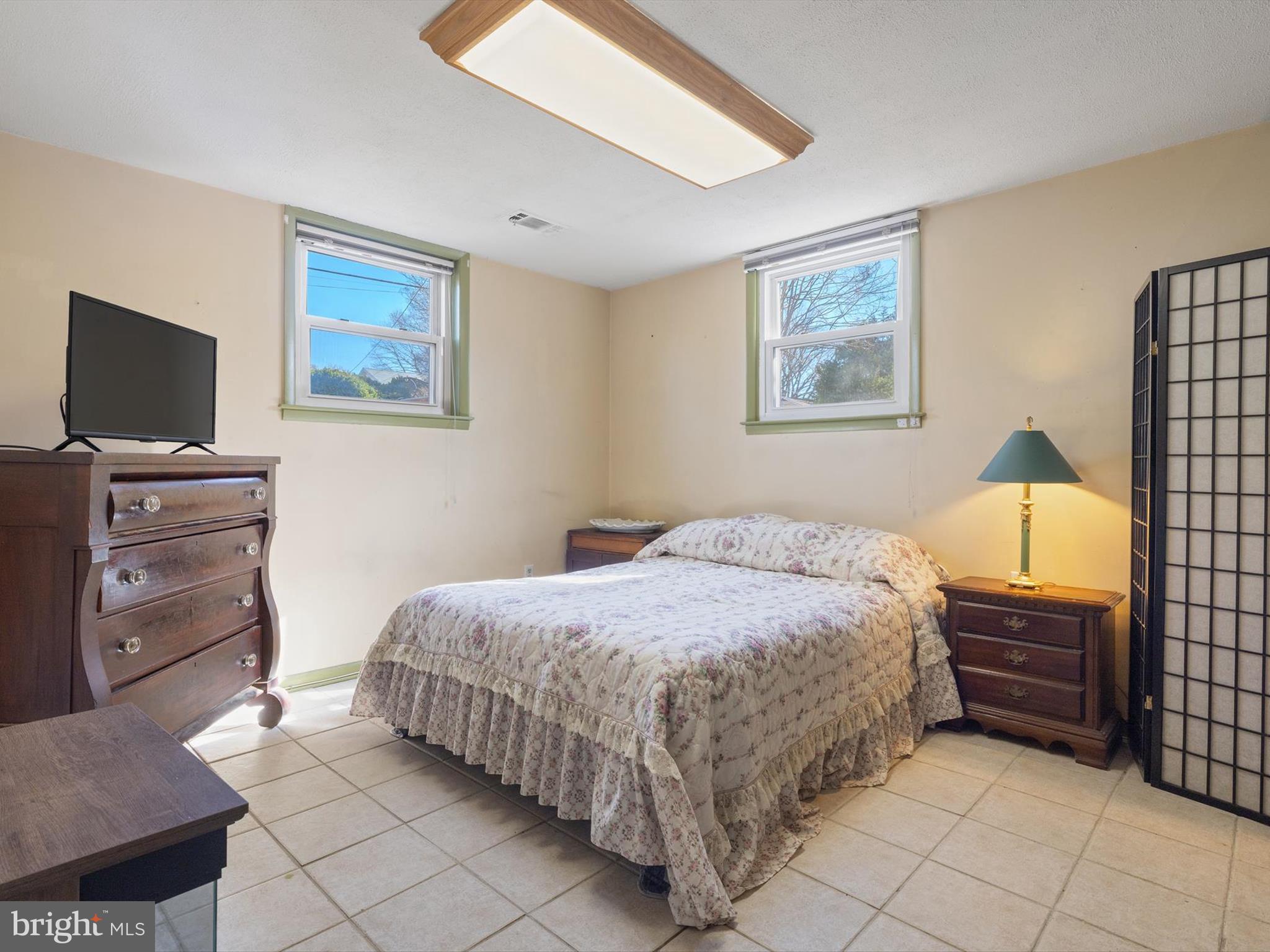 1345 Ava Road Severn, MD 21144 - Photo 32 of 41 a bedroom with a bed and a television