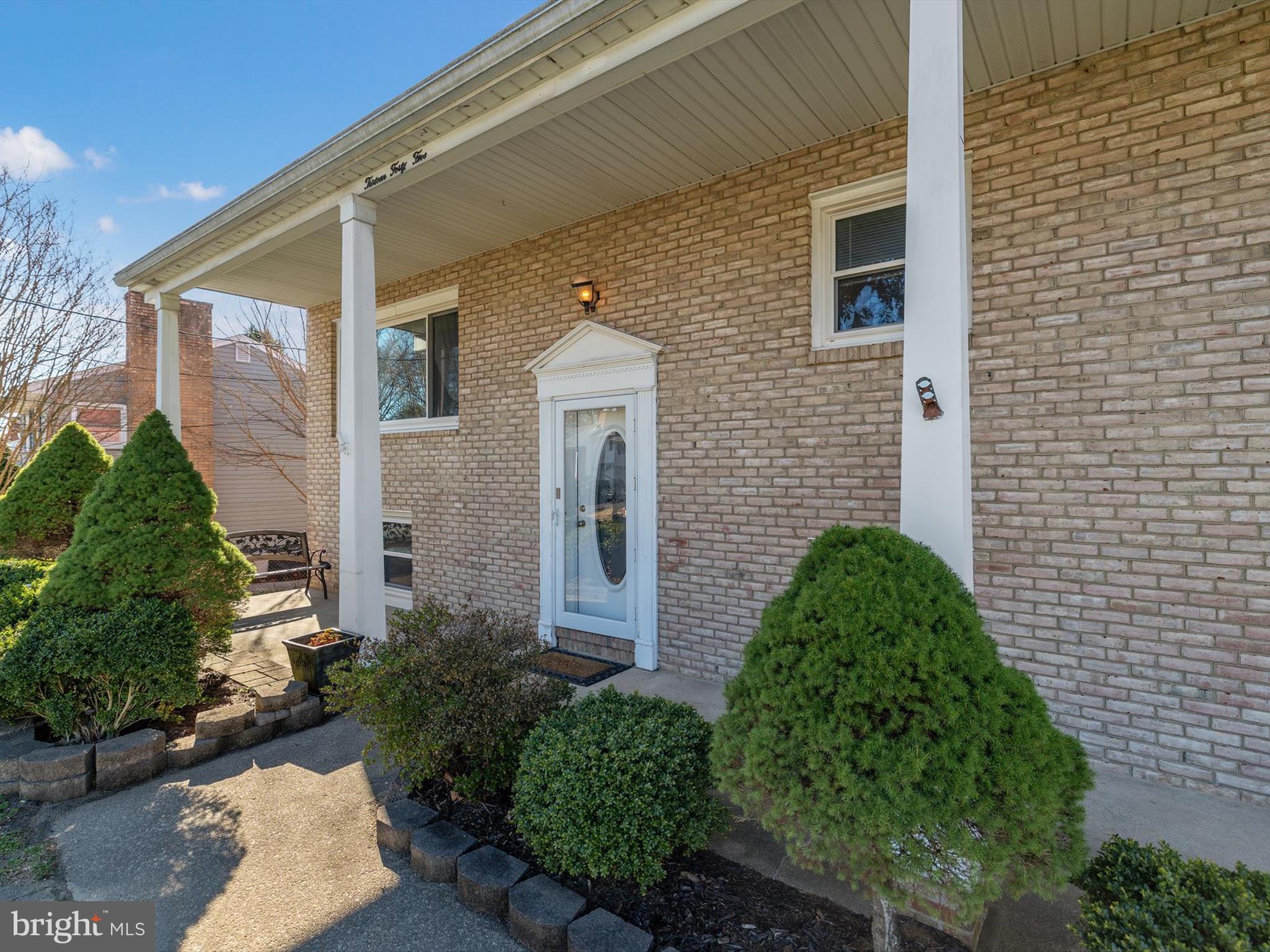 1345 Ava Road Severn, MD 21144 - Photo 4 of 41 a brick house with a yard