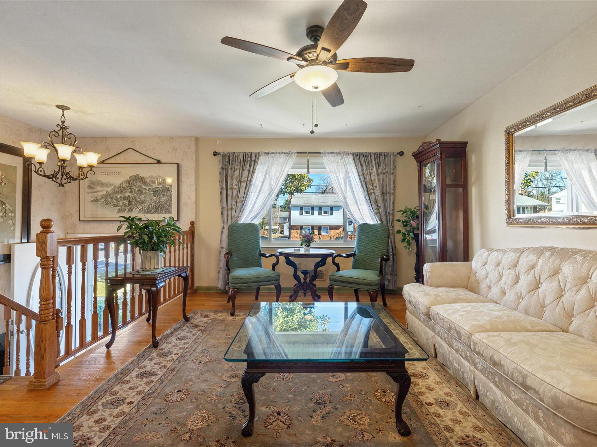 1345 Ava Road Severn, MD 21144 - Photo 6 of 41 a living room with furniture a chandelier and a large window