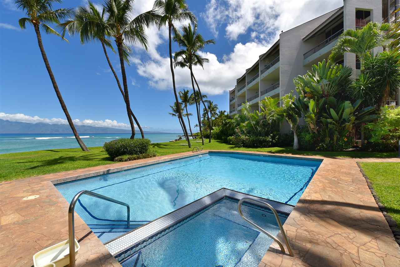 a view of swimming pool with chairs