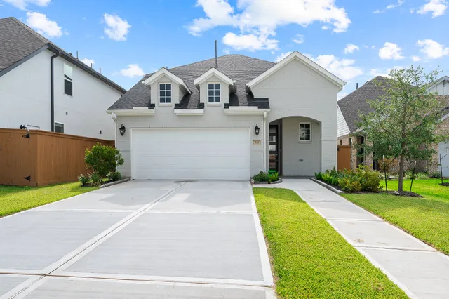 a front view of a house with yard