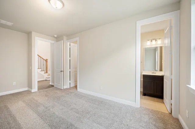 a view of an empty room and closet area