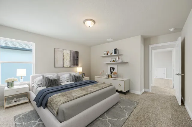 a bedroom with a bed and furniture