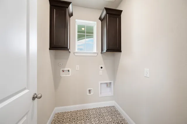 a view of bathroom with a sink and a window