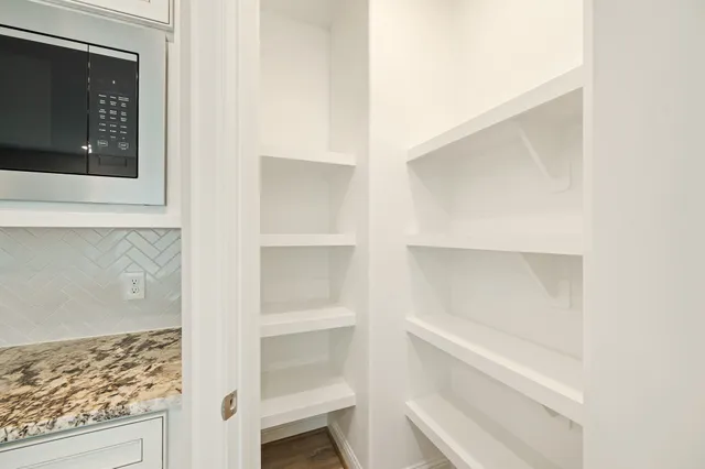 a view of an empty walk in closet