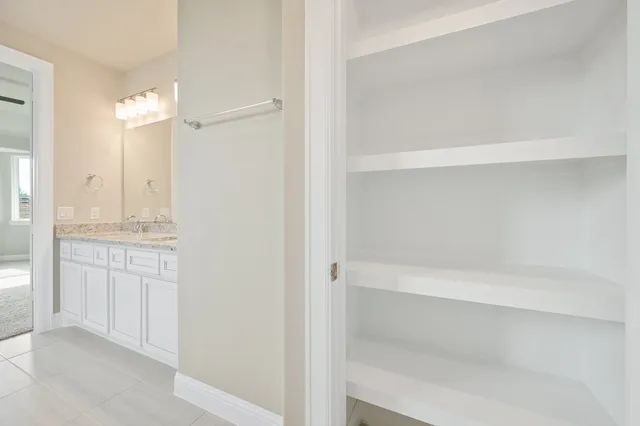 a bathroom with a shower and a sink