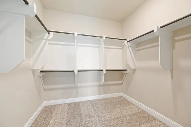 a view of an empty walk in closet