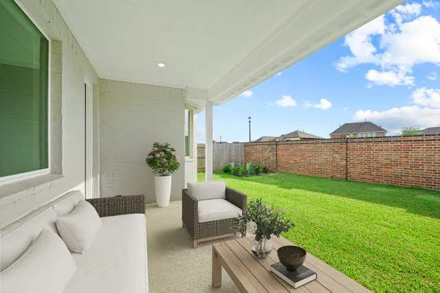 a balcony with furniture and a garden
