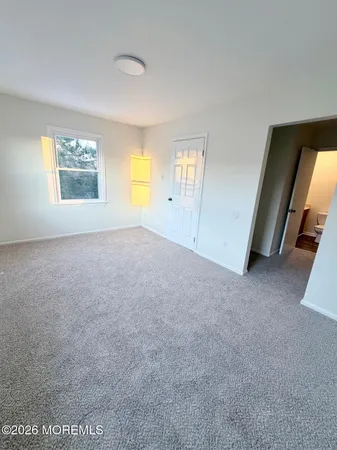 a view of empty room with front door