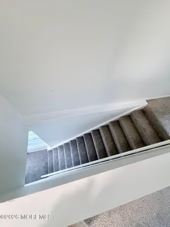 a view of empty room with ceiling fan