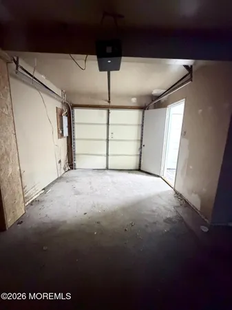 a bathroom with a toilet a sink and a window