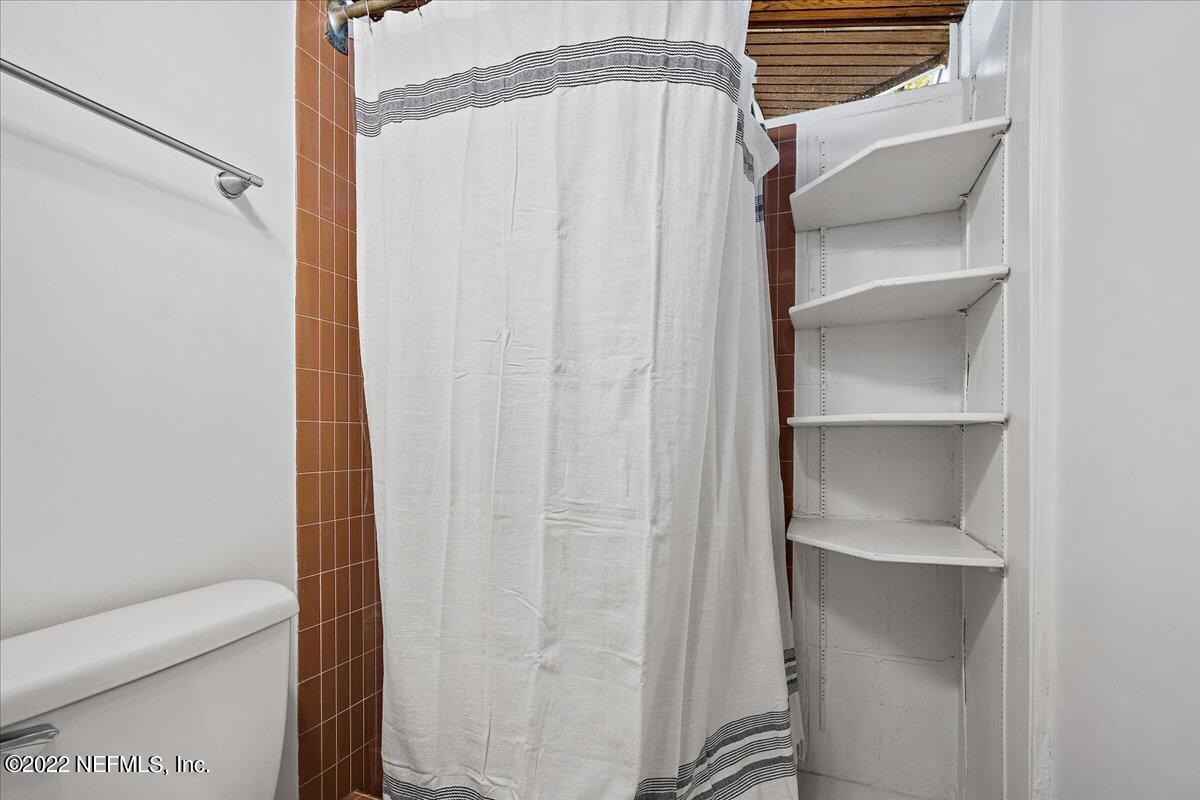 1613 Ocean Boulevard Atlantic Beach, FL 32233 - Photo 7 of 9 a bathroom with a shower