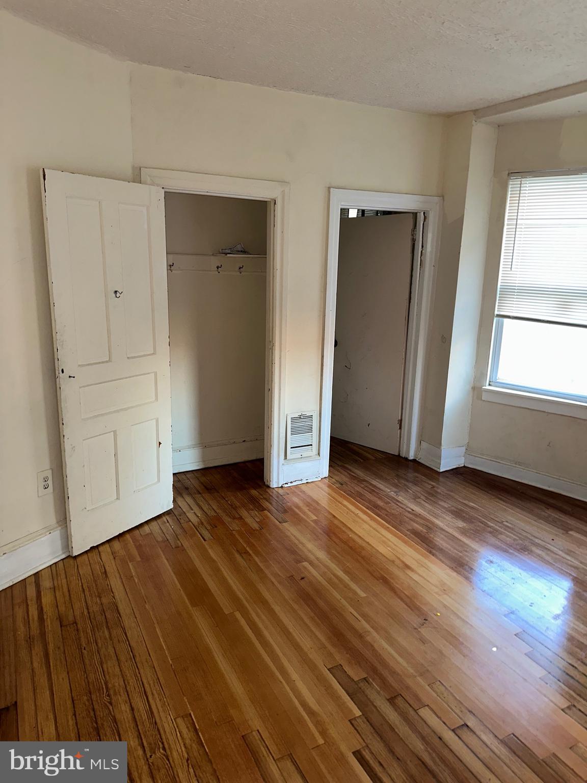 51 High Street Philadelphia, PA 19144 - Photo 14 of 20 a view of an empty room with wooden floor and window