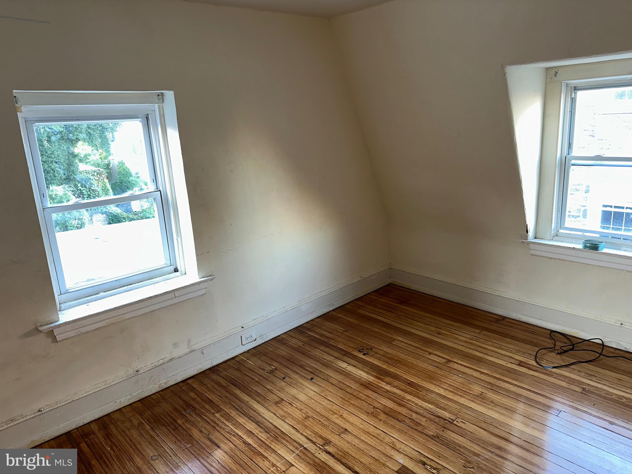 51 High Street Philadelphia, PA 19144 - Photo 17 of 20 a view of an empty room with wooden floor and a window