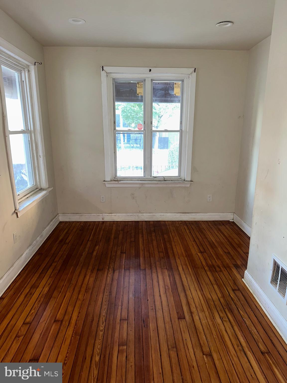 51 High Street Philadelphia, PA 19144 - Photo 5 of 20 an empty room with wooden floor and windows