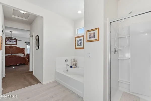 a en suite bathroom with a tub and a shower