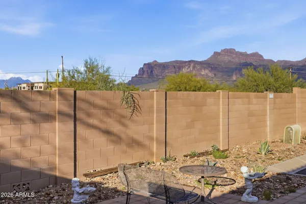 a view of a terrace with a table and chairs