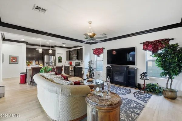 a living room with furniture and a flat screen tv