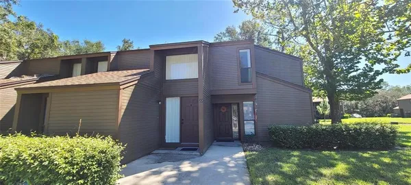 a brick house with a large windows