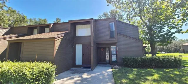 a brick house with a large windows