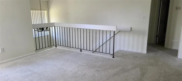 a view of a hallway with windows