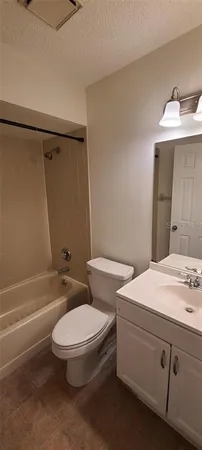 a bathroom with a toilet a sink and bathtub