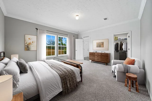a bedroom with bed and wooden floor