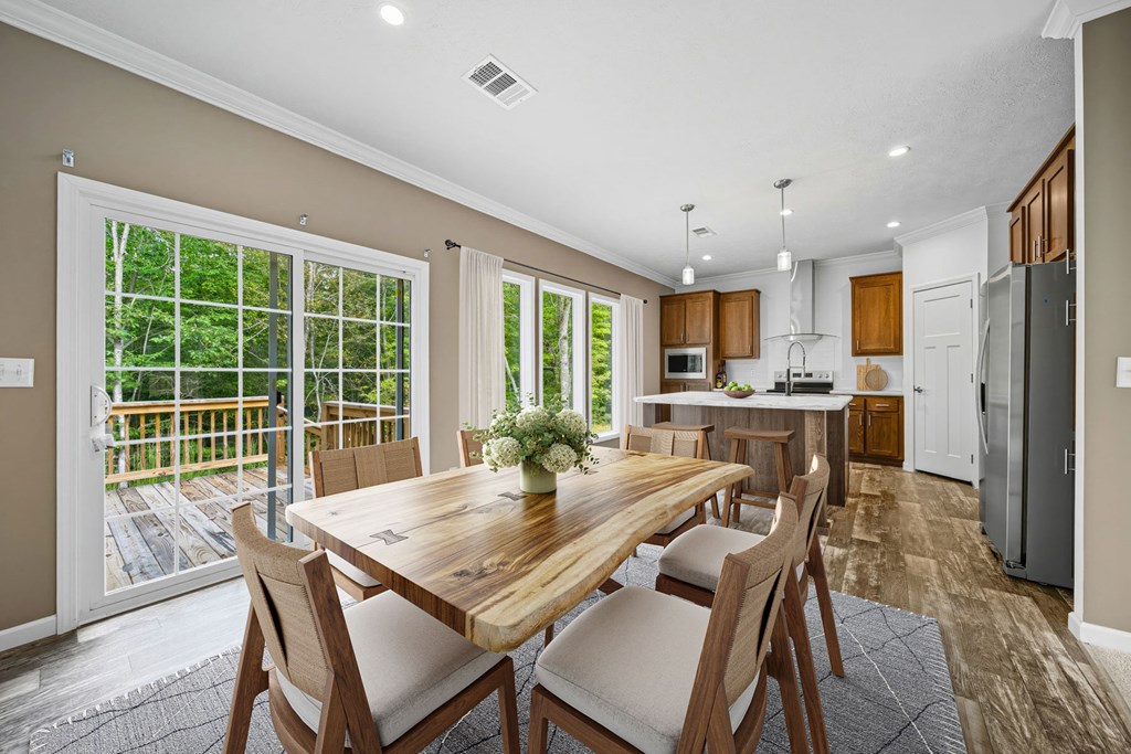 155 Linda Lane Murphy, NC 28906 - Photo 6 of 12 a view of a dining room with furniture window and wooden floor